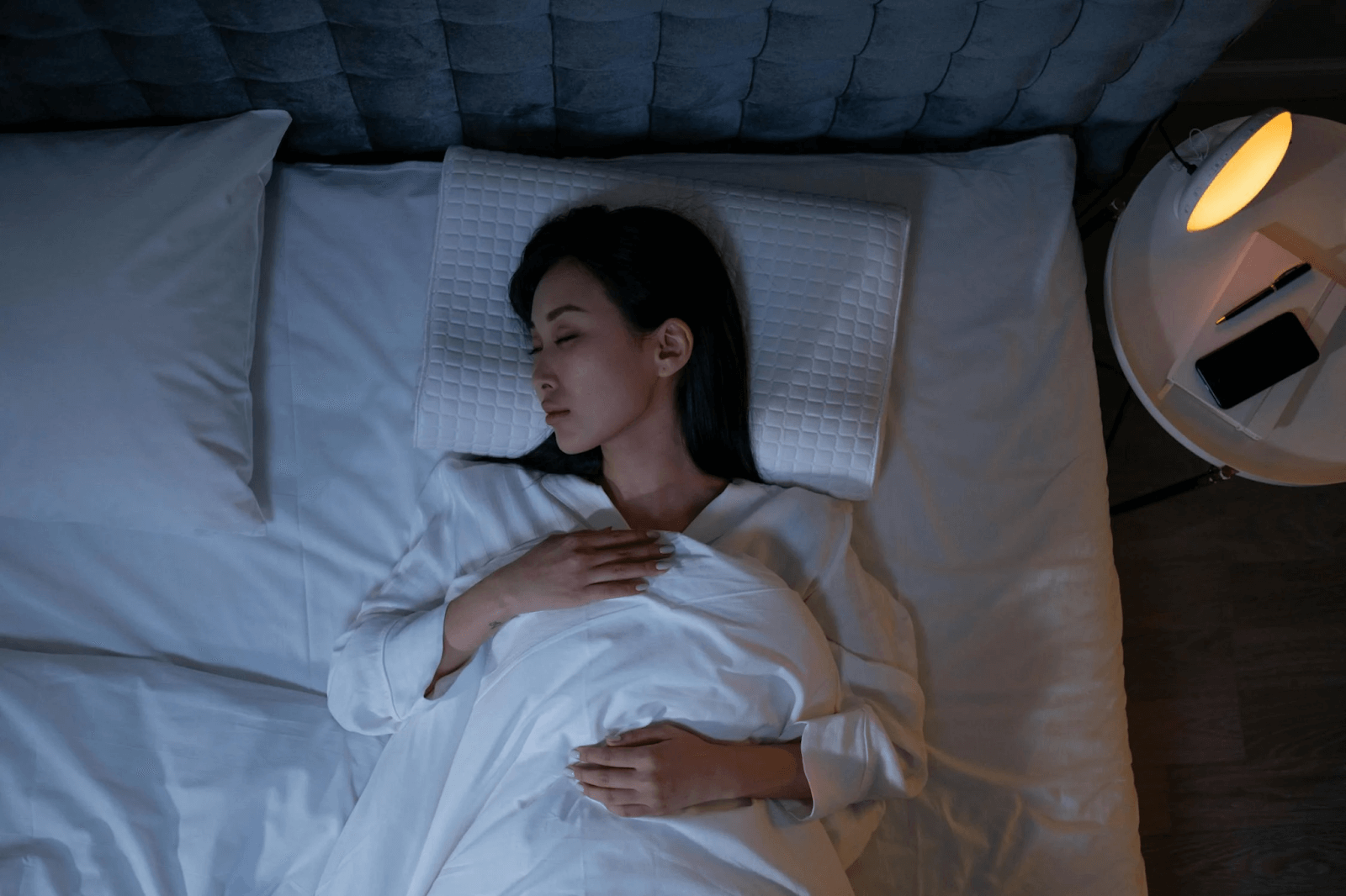 Women sleeping on bed practicing the 4-7-8 breathing technique for relaxation and better sleep