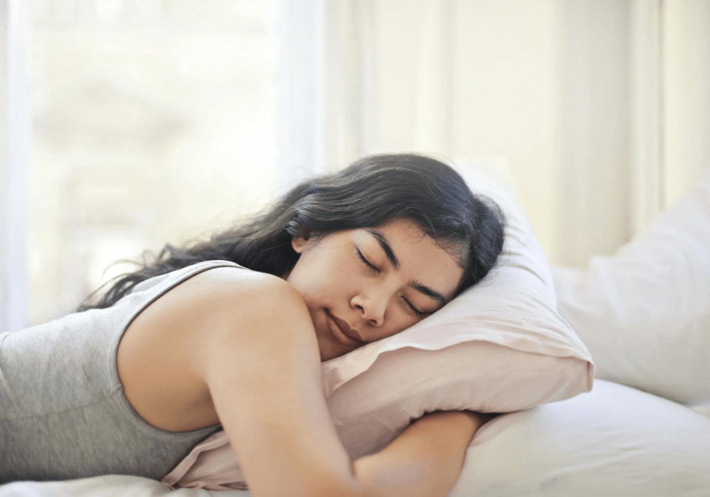 Women sleeping peacefully while practicing breathing exercises for sleep to promote relaxation and restful rest.