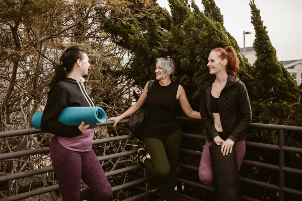 A group of women seated in a circle, sharing positive affirmations for women