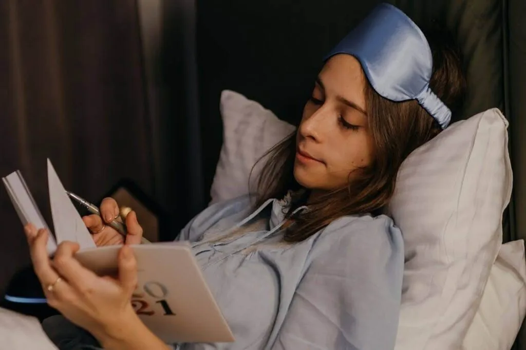 A woman reading a book to cope with her cabin fever